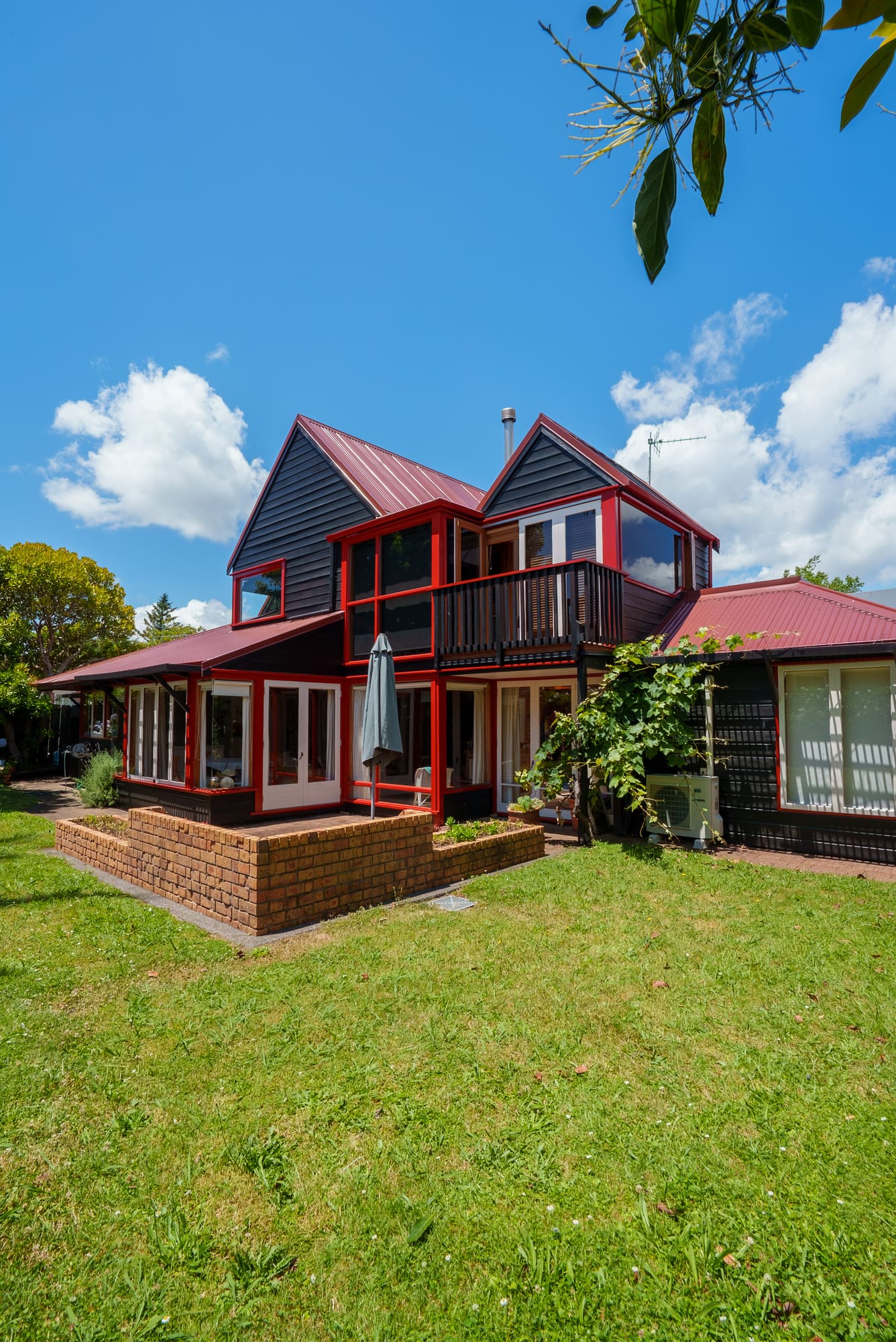 A tall view of the two-storey elevation with balcony and gable.